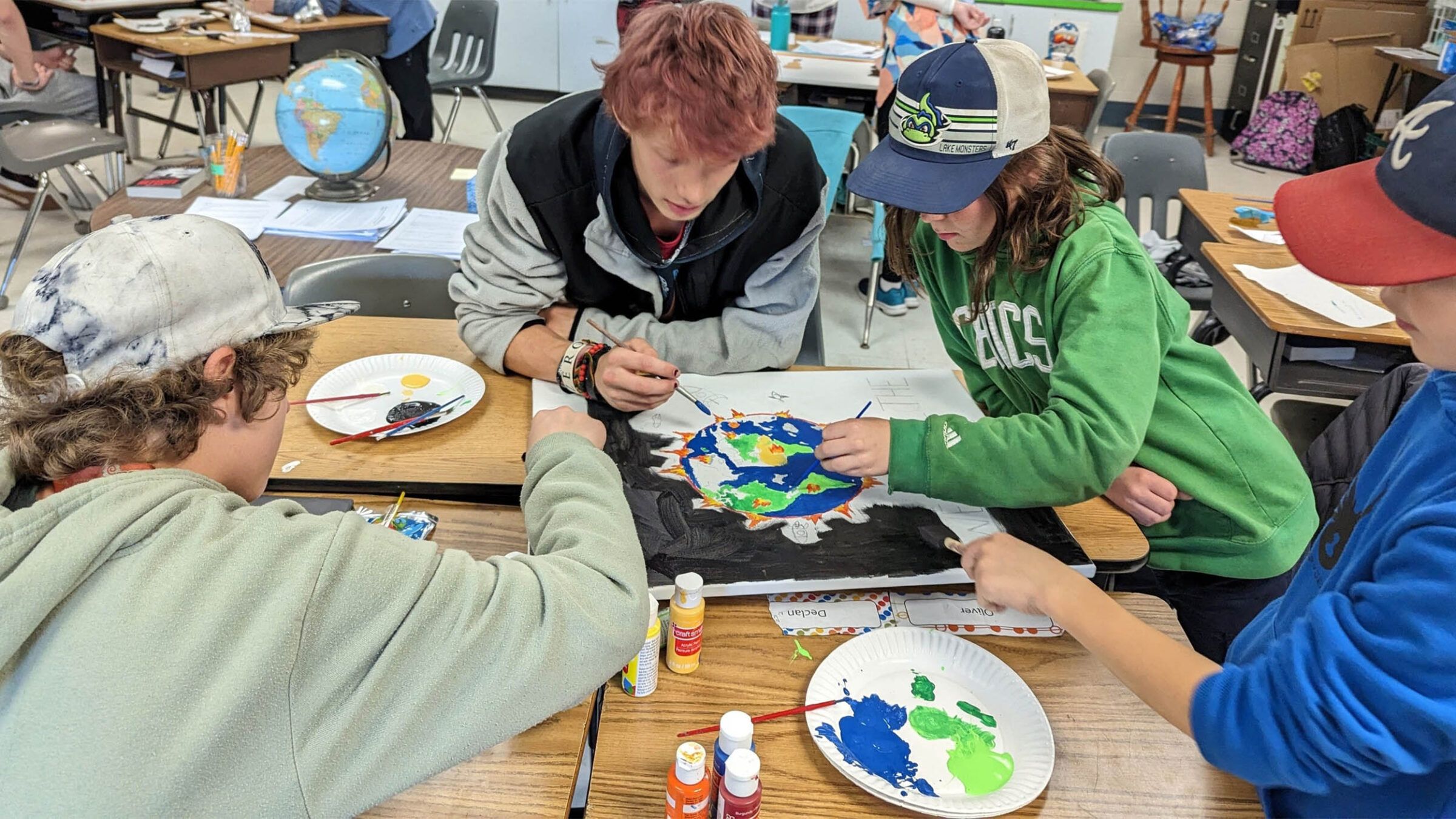 younger students doing an art project