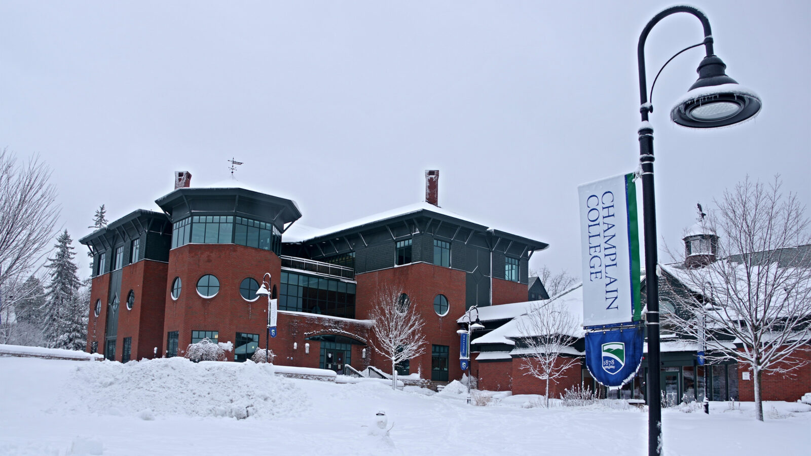 View of Miller Information Commons covered in snow in the winter