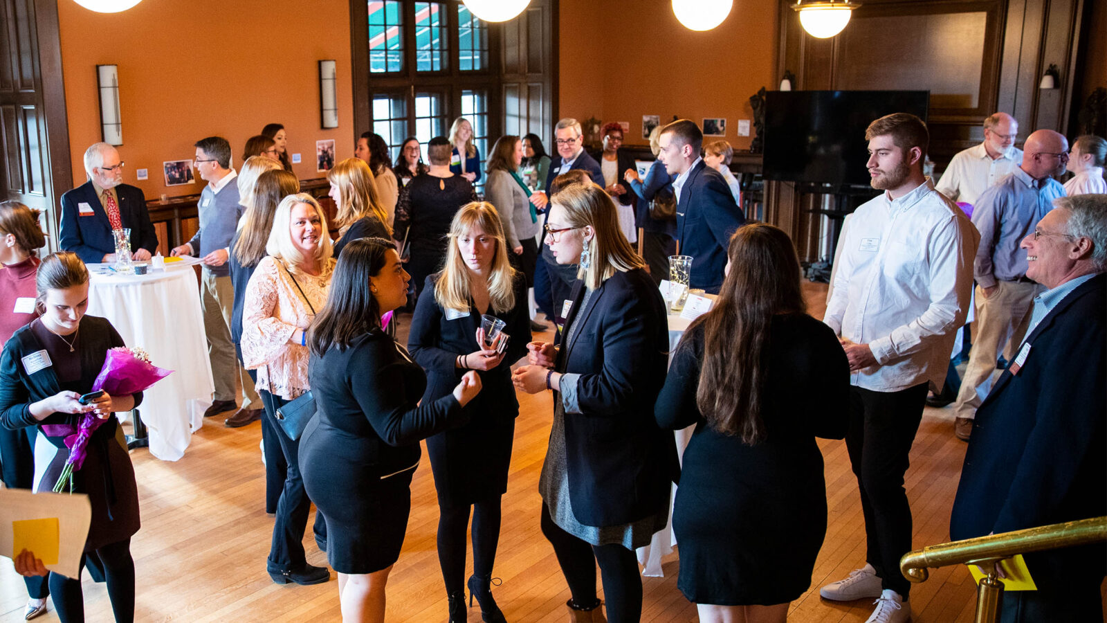 A room full of business professionals networking