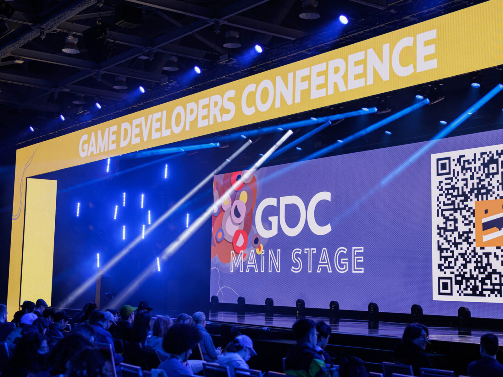 a wide shot of the main presentation stage at the game developers conference