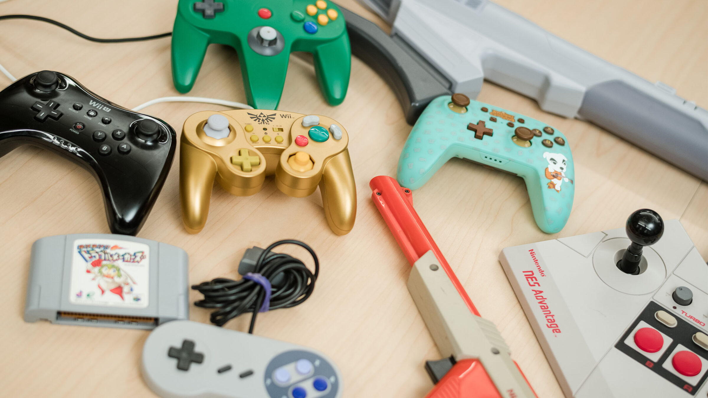 a collection of various game controllers on a table