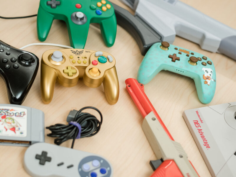 a collection of various game controllers on a table