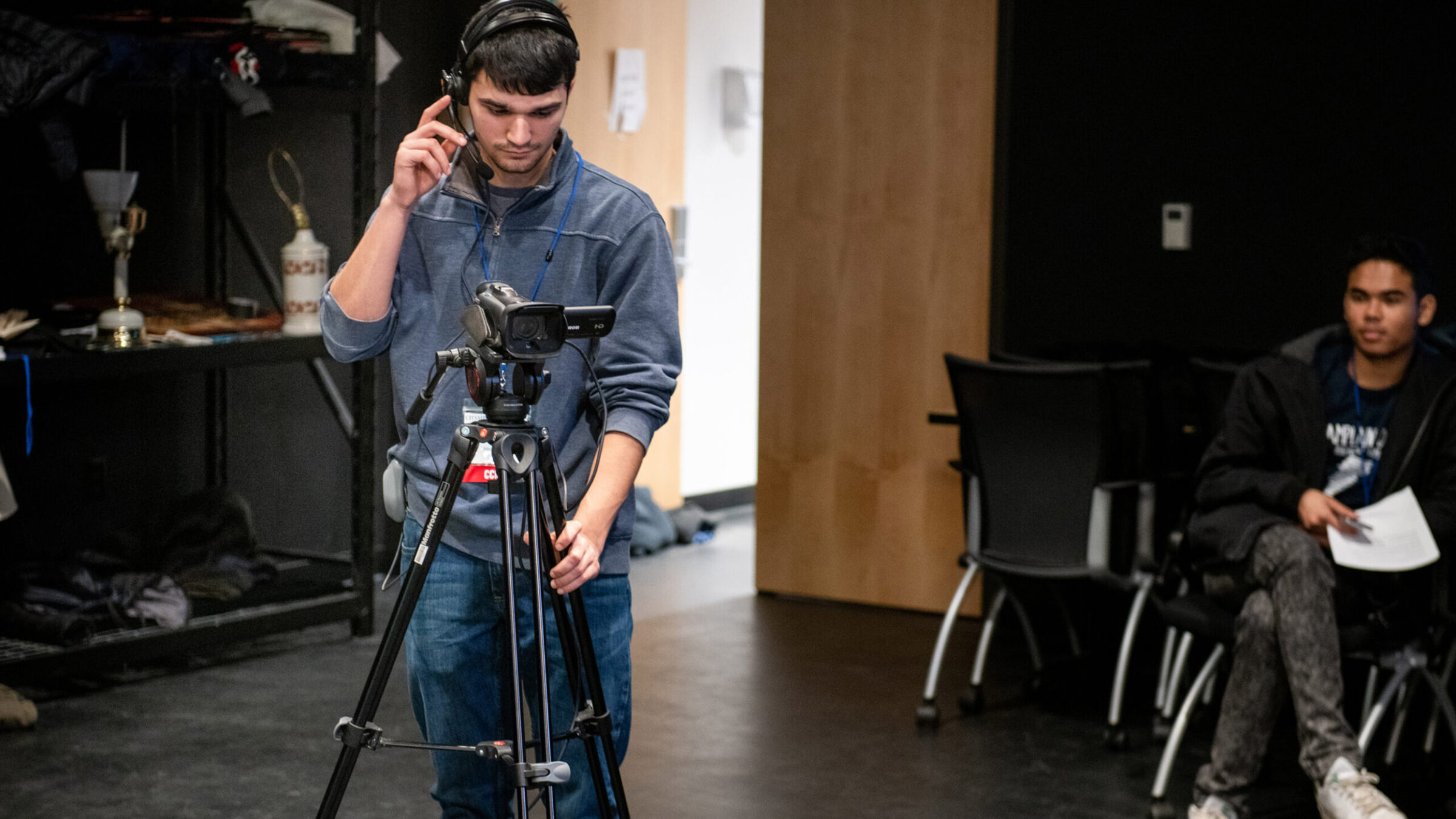 student operates video camera during a live shoot