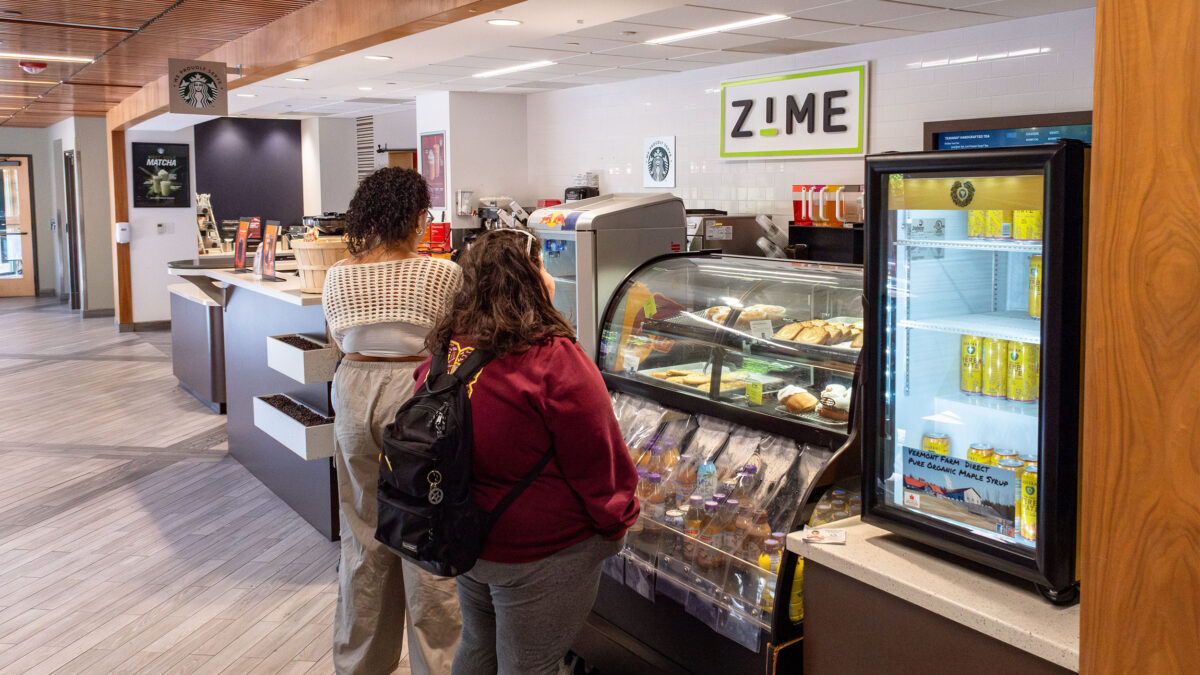 two students wait for their order at the Zime café