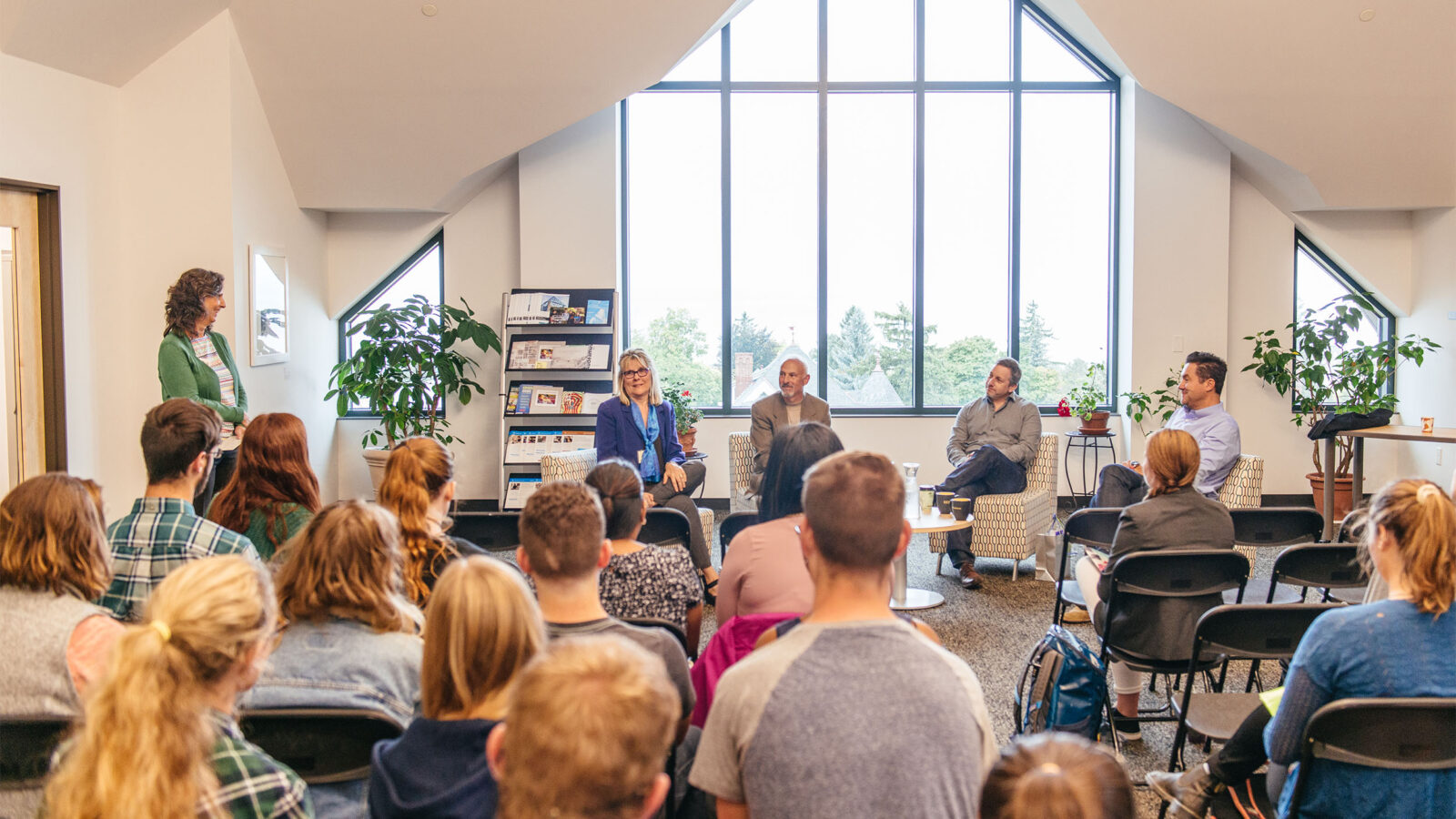 four event speakers talk to students in the ccm building