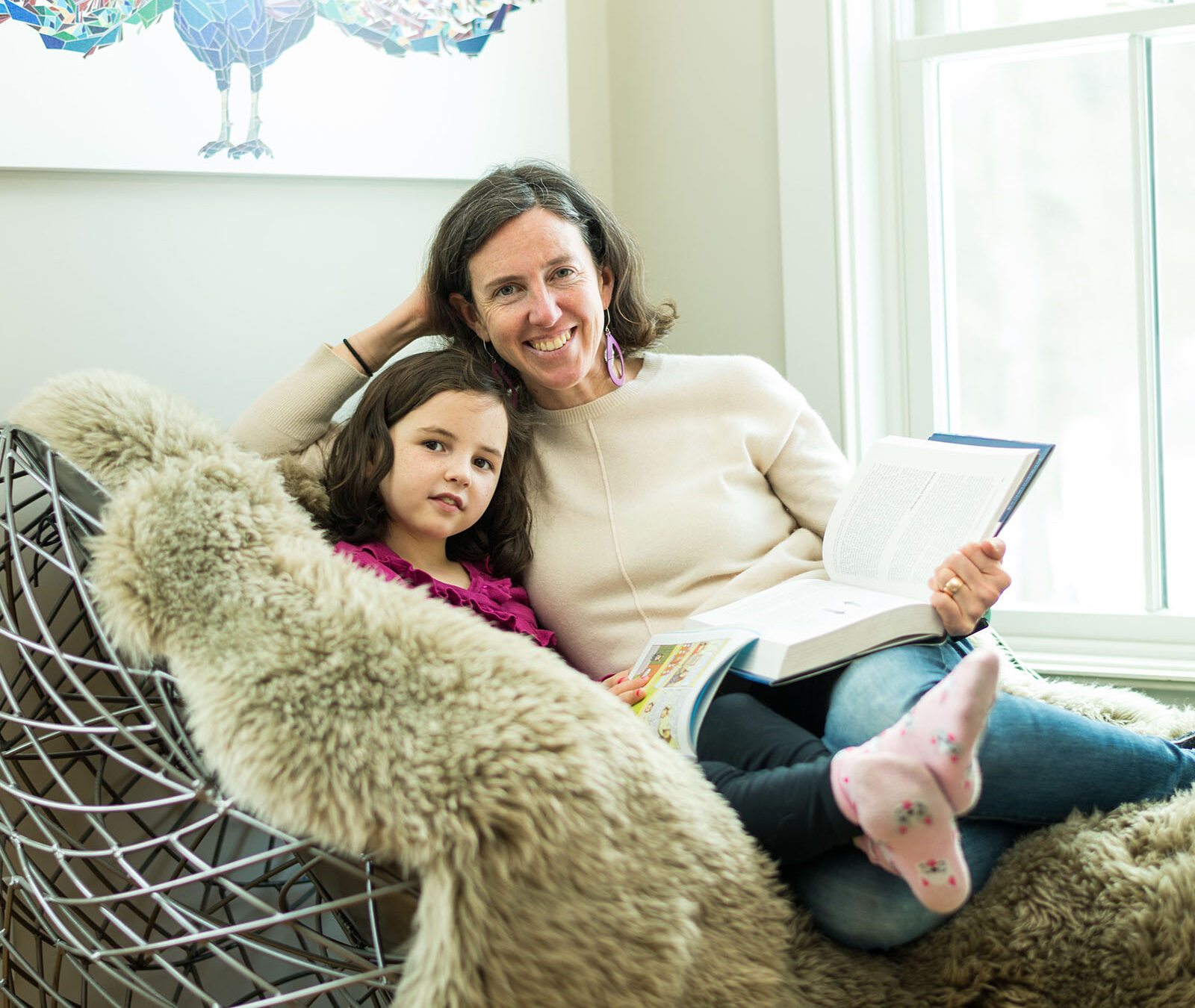 mother and daughter reading books together