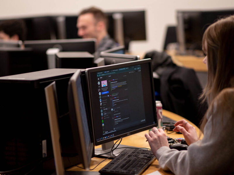 a cybersecurity student working in a computer lab