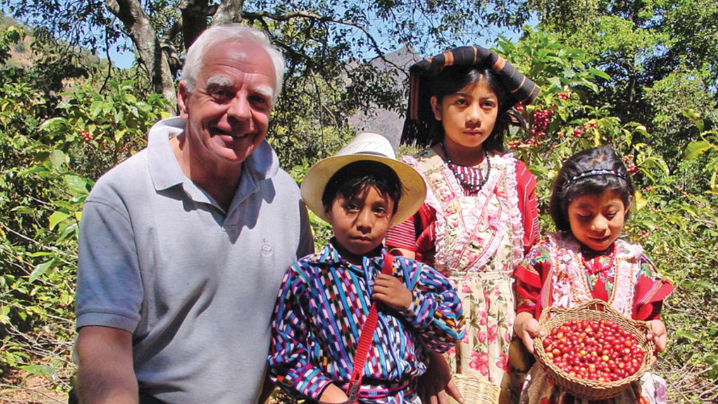 Bob Stiller with 3 children on a coffee farm