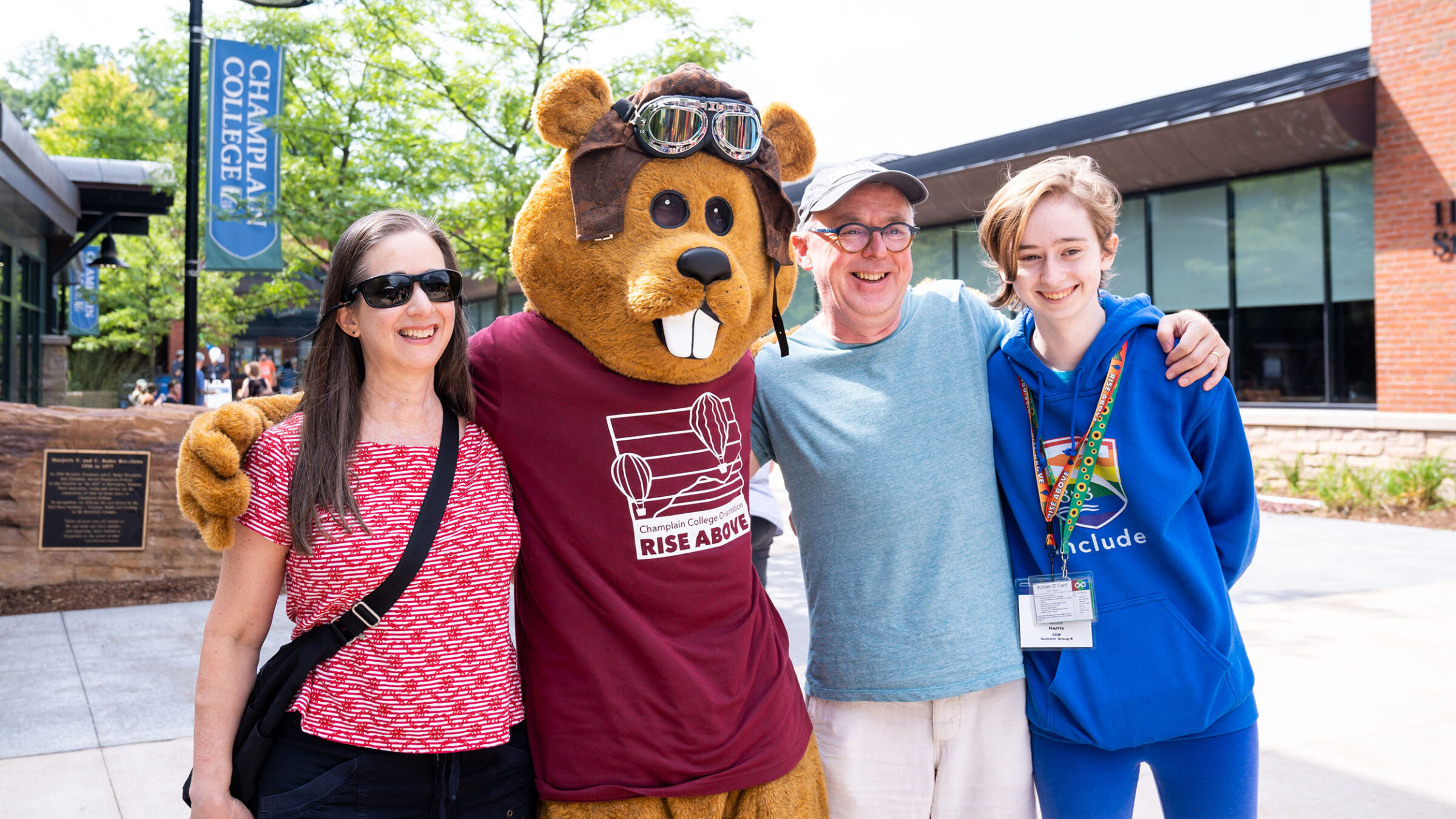 a family poses with Chauncey for a photo at orientation
