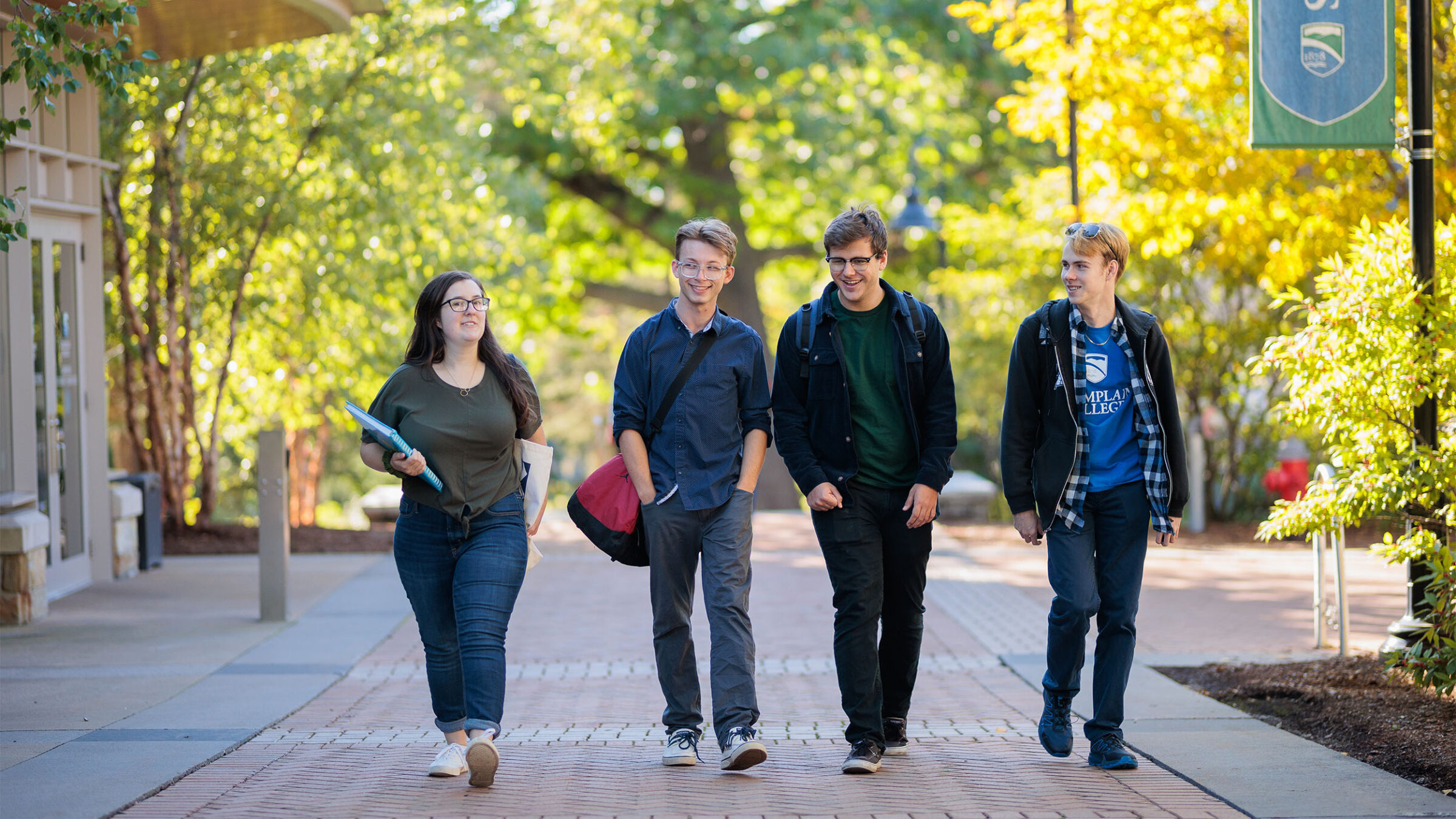 four students walking together after class