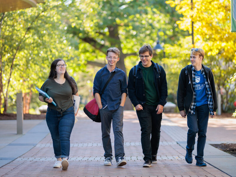 four students walking together after class