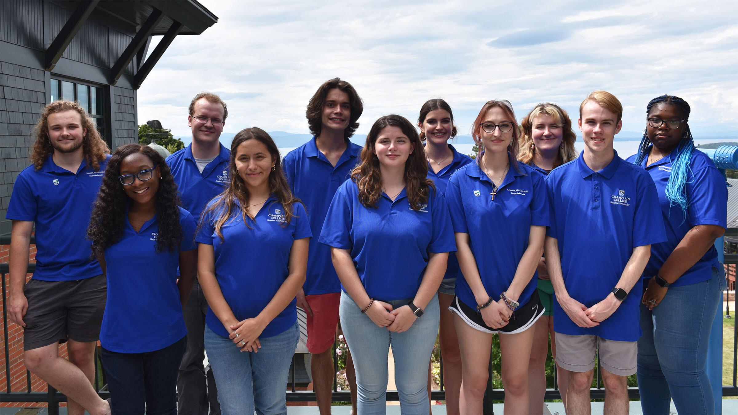 champlain college student ambassadors line up for a group photo wearing matching blue tshirts