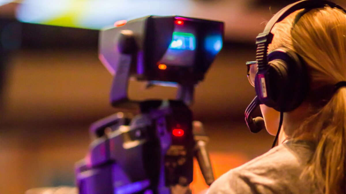 a student using a film camera