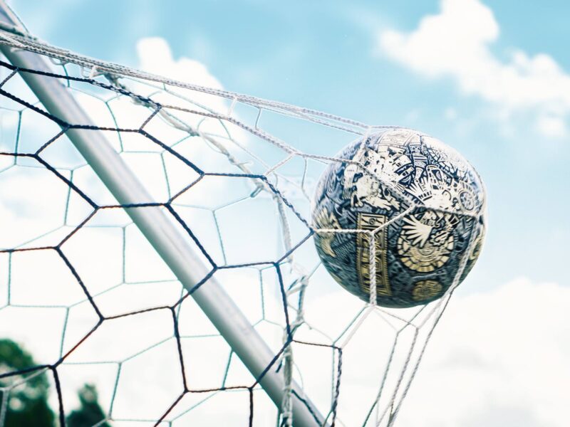 Soccer ball hitting goal net