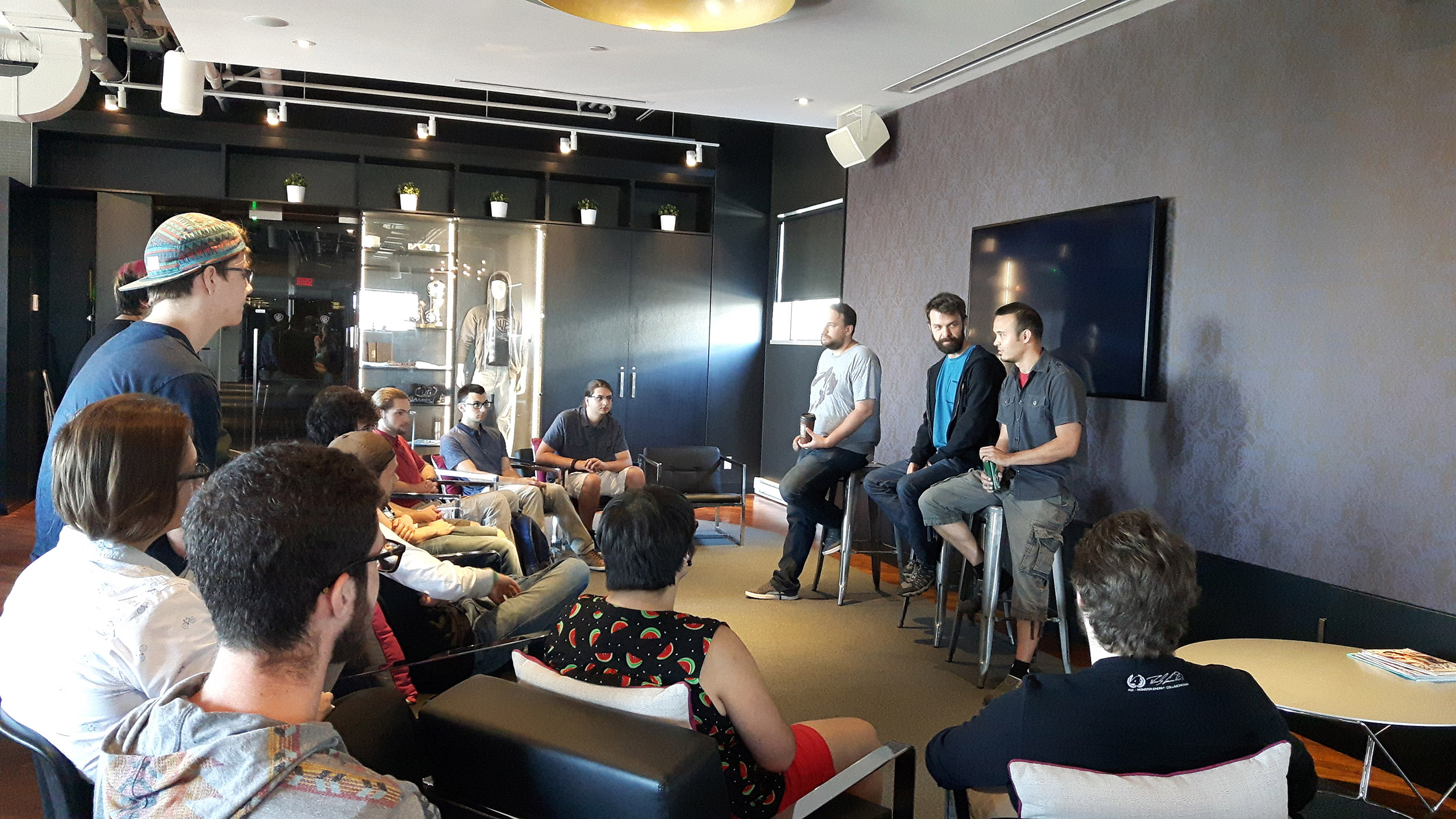 group of student listen to professionals at a company visit