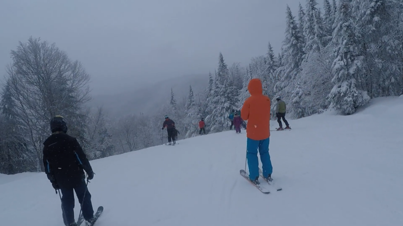 several vermont skiiers heading down-hill