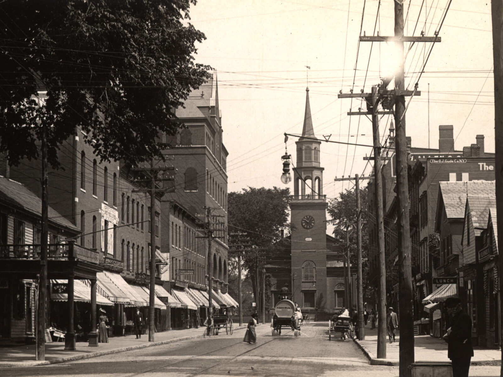 Black and white postcard depicting a view of the upper block of Church Street in Burlington, Vermont, looking north from Cherry Street.