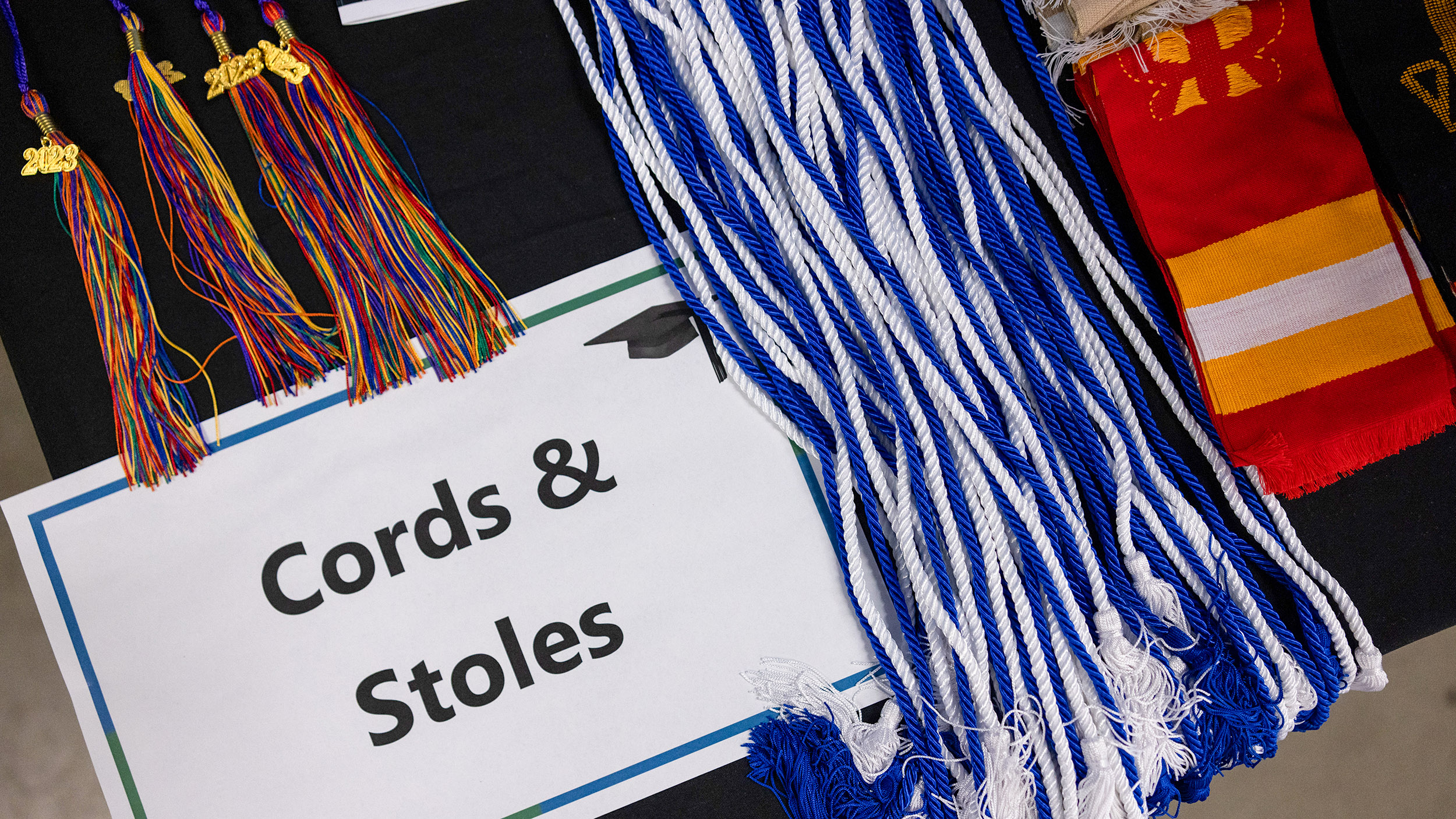 a display of various cords & stoles for commencement
