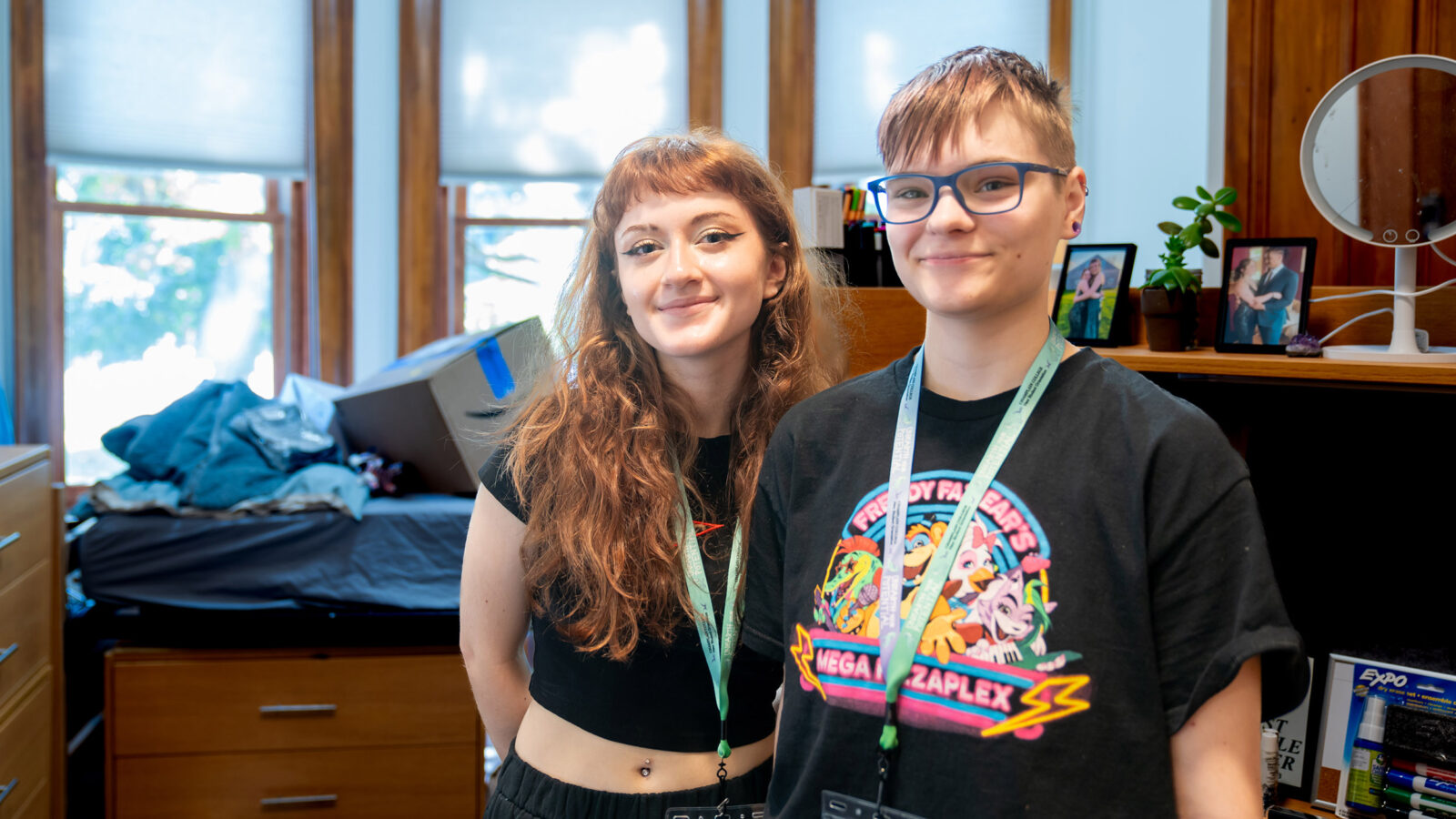 roommates stand side by side in new res hall room