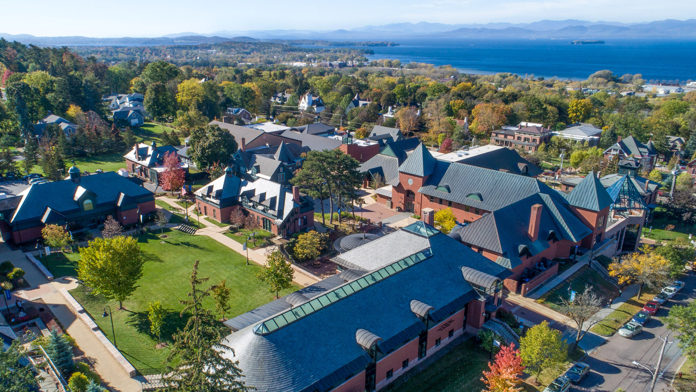 scenic campus aerial photo with Lake Champlain and Adirondack mountains in the background