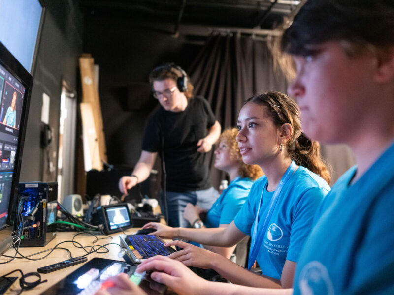 High school students edit video footage at a Champlain College Pre-College Summer program.