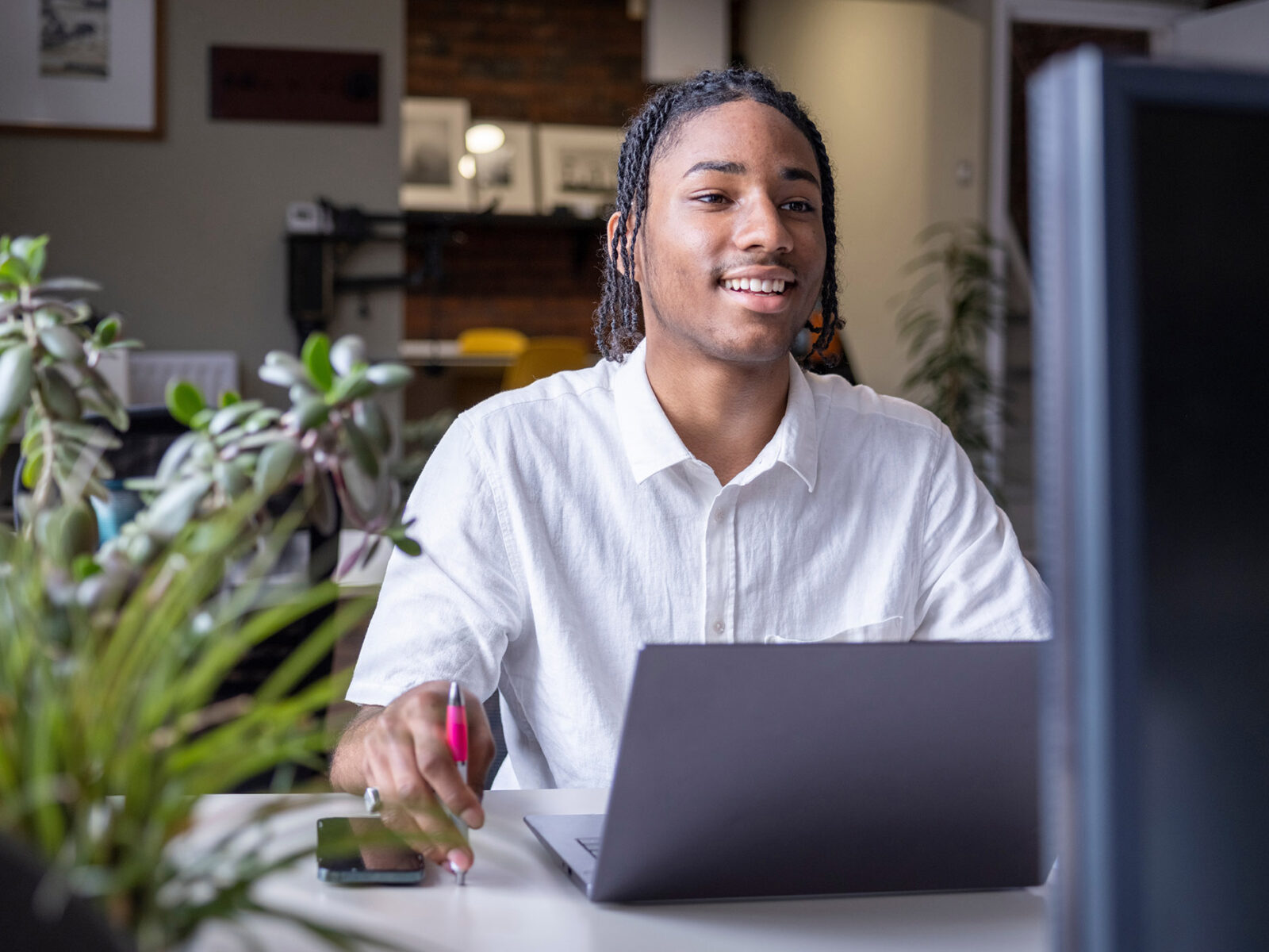 young man views something on a laptop