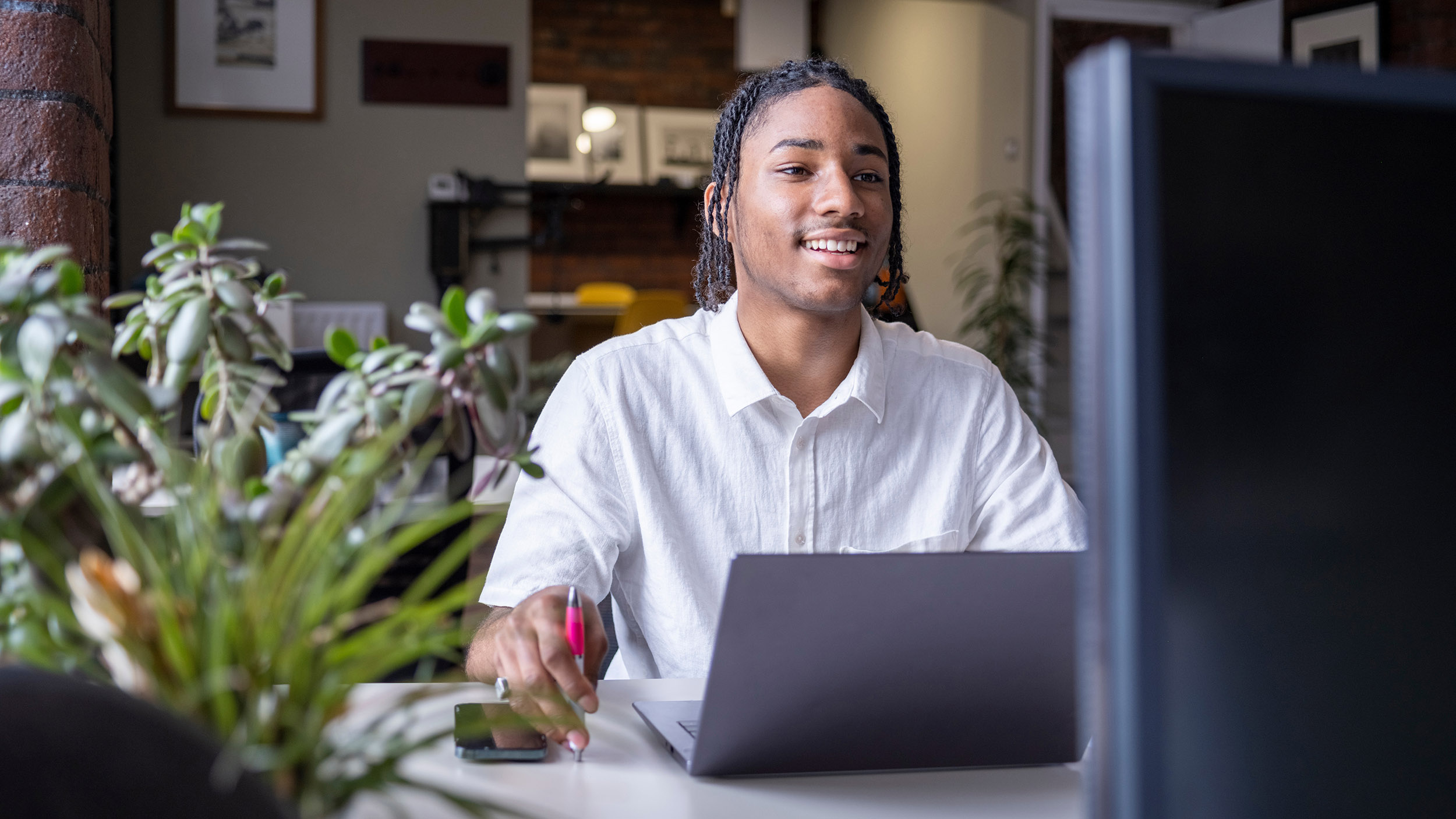 young man views something on a laptop