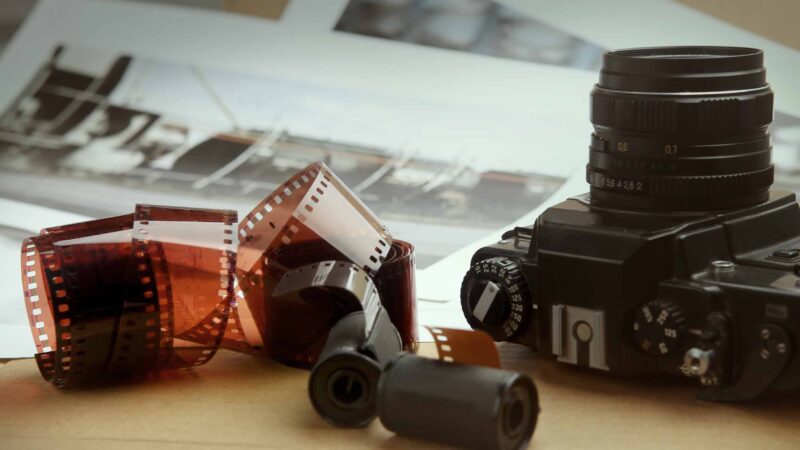 darkroom film and a camera on a table