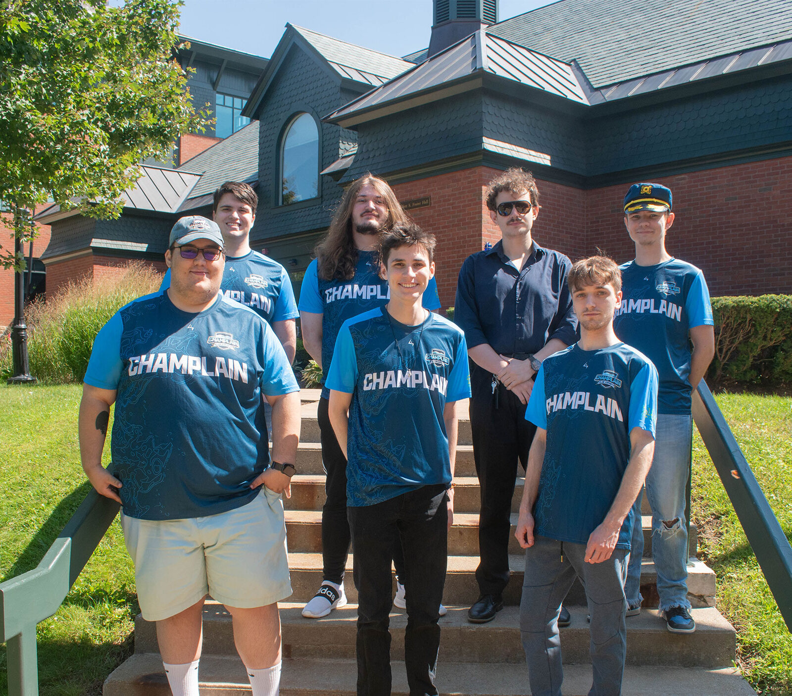 seven esports players pose for a team photo in aiken quad wearing their esports jerseys