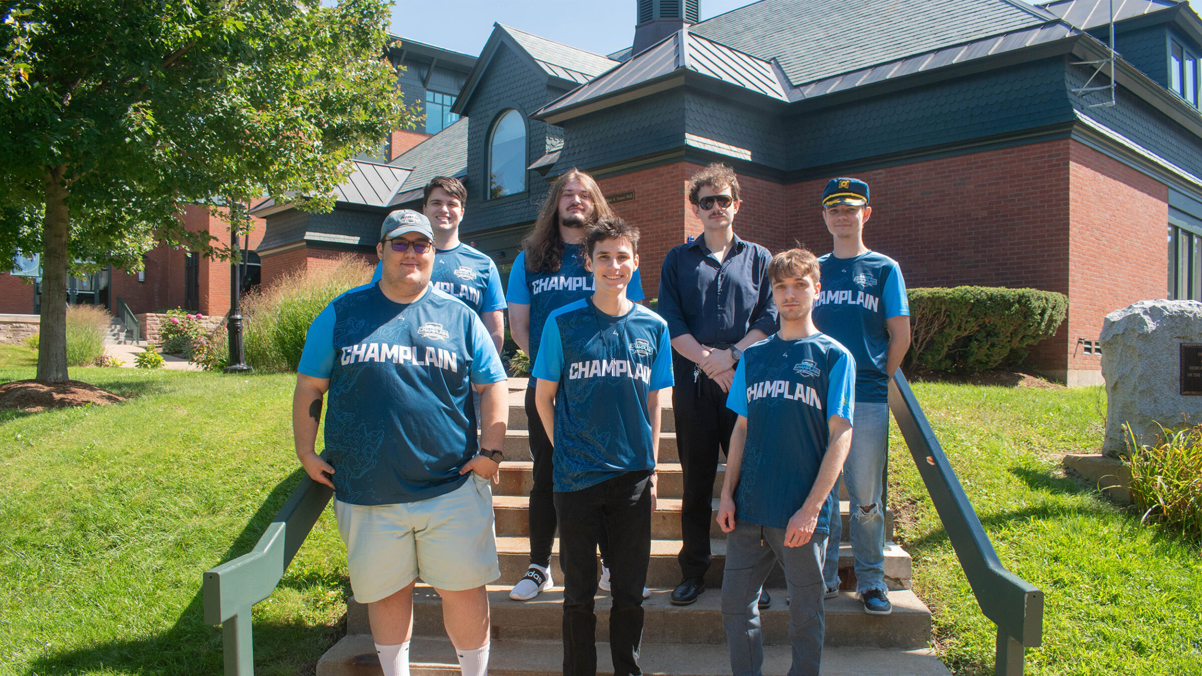 seven esports players pose for a team photo in aiken quad wearing their esports jerseys