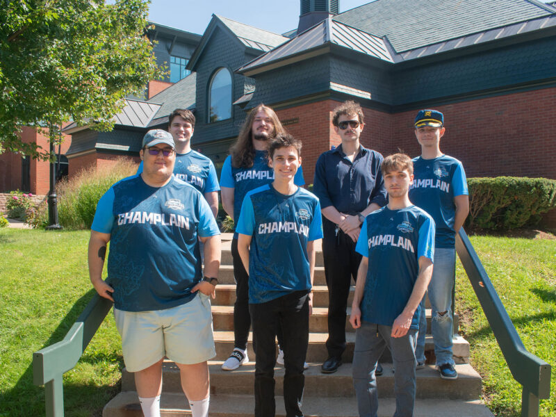 seven esports players pose for a team photo in aiken quad wearing their esports jerseys