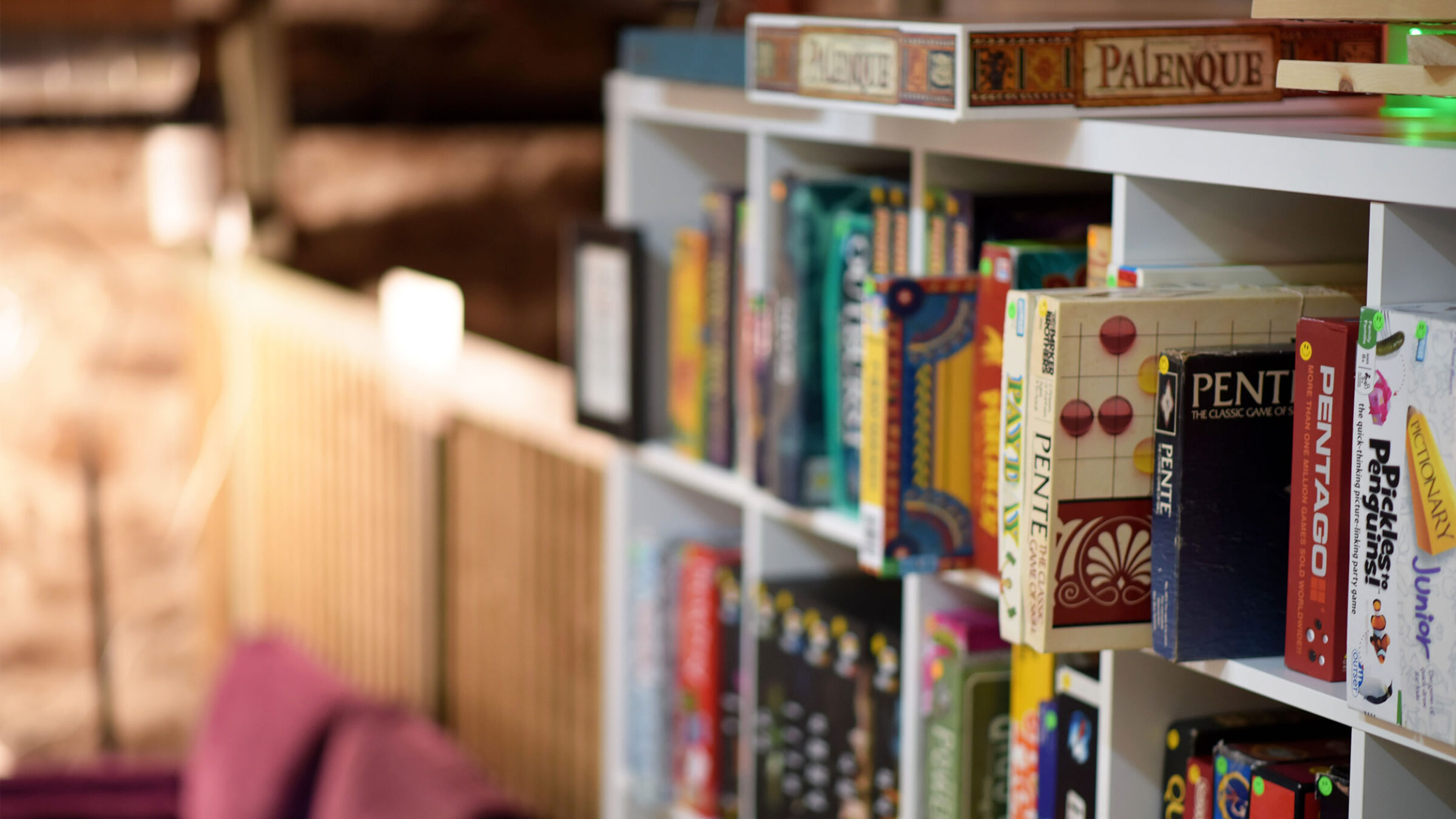 board games on a bookshelf