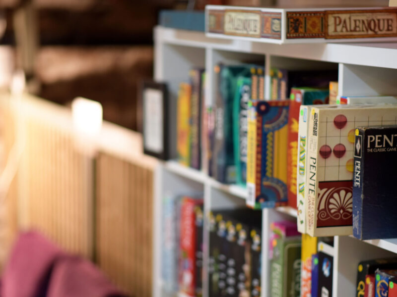 board games on a bookshelf