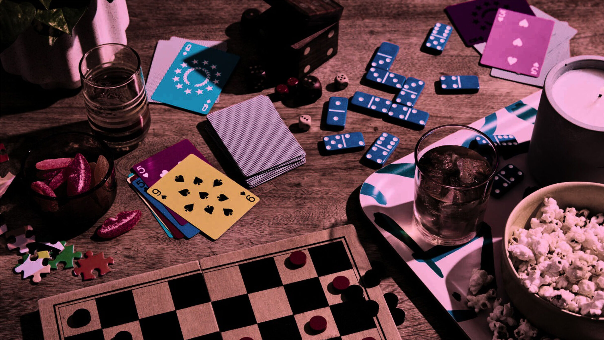 board games and popcorn dispersed along a wooden table