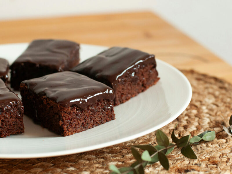 plate of chocolate frosted brownies