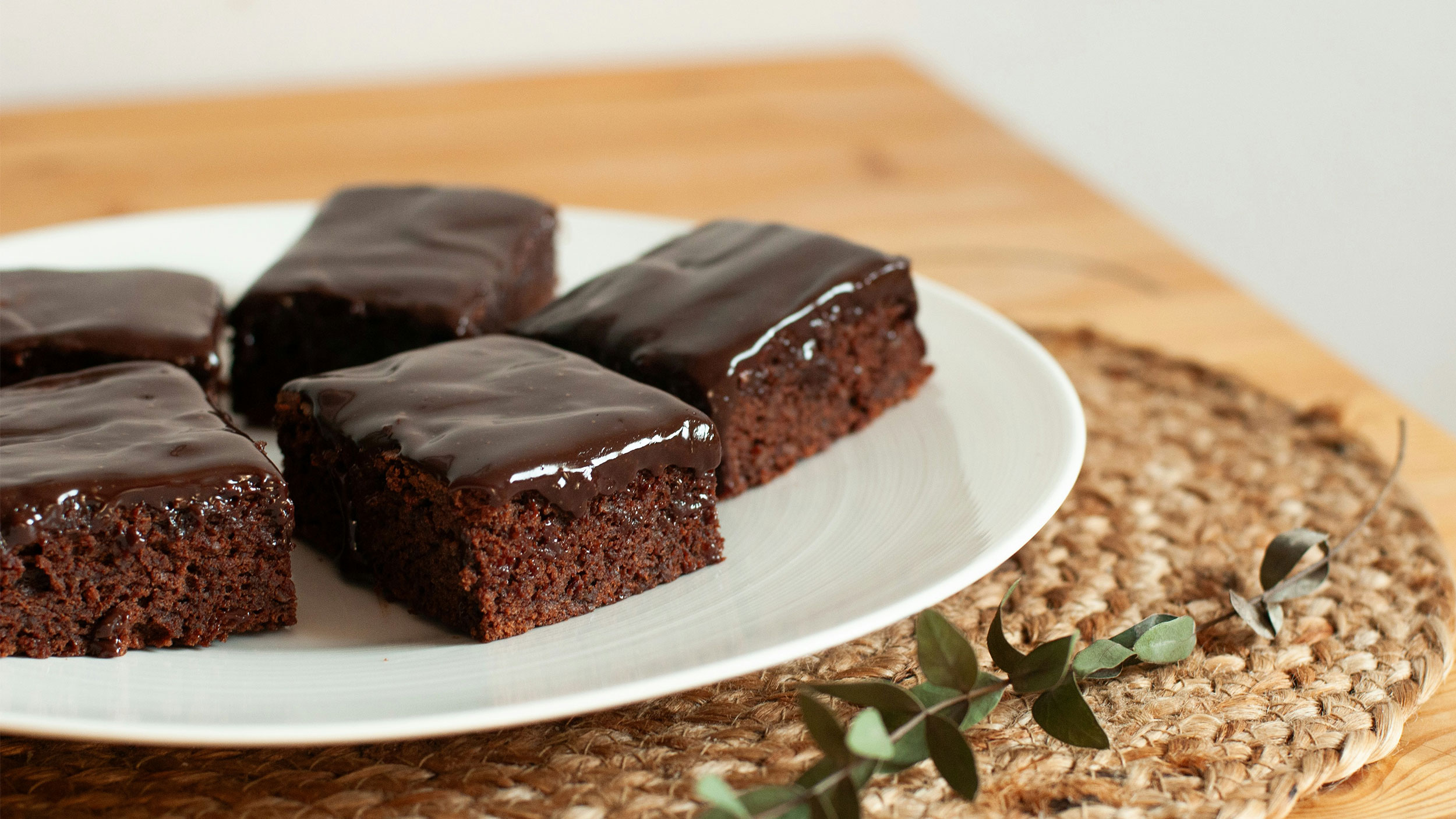 plate of chocolate frosted brownies