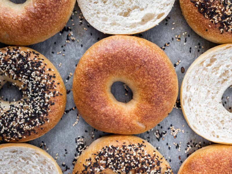 a variety of bagels on a tray