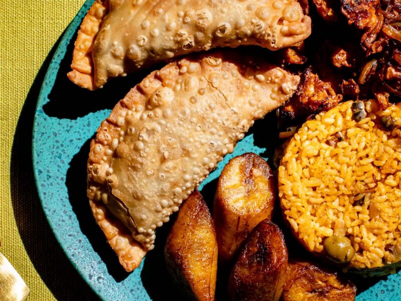 close up photo of puerto rican foods on a blue plate