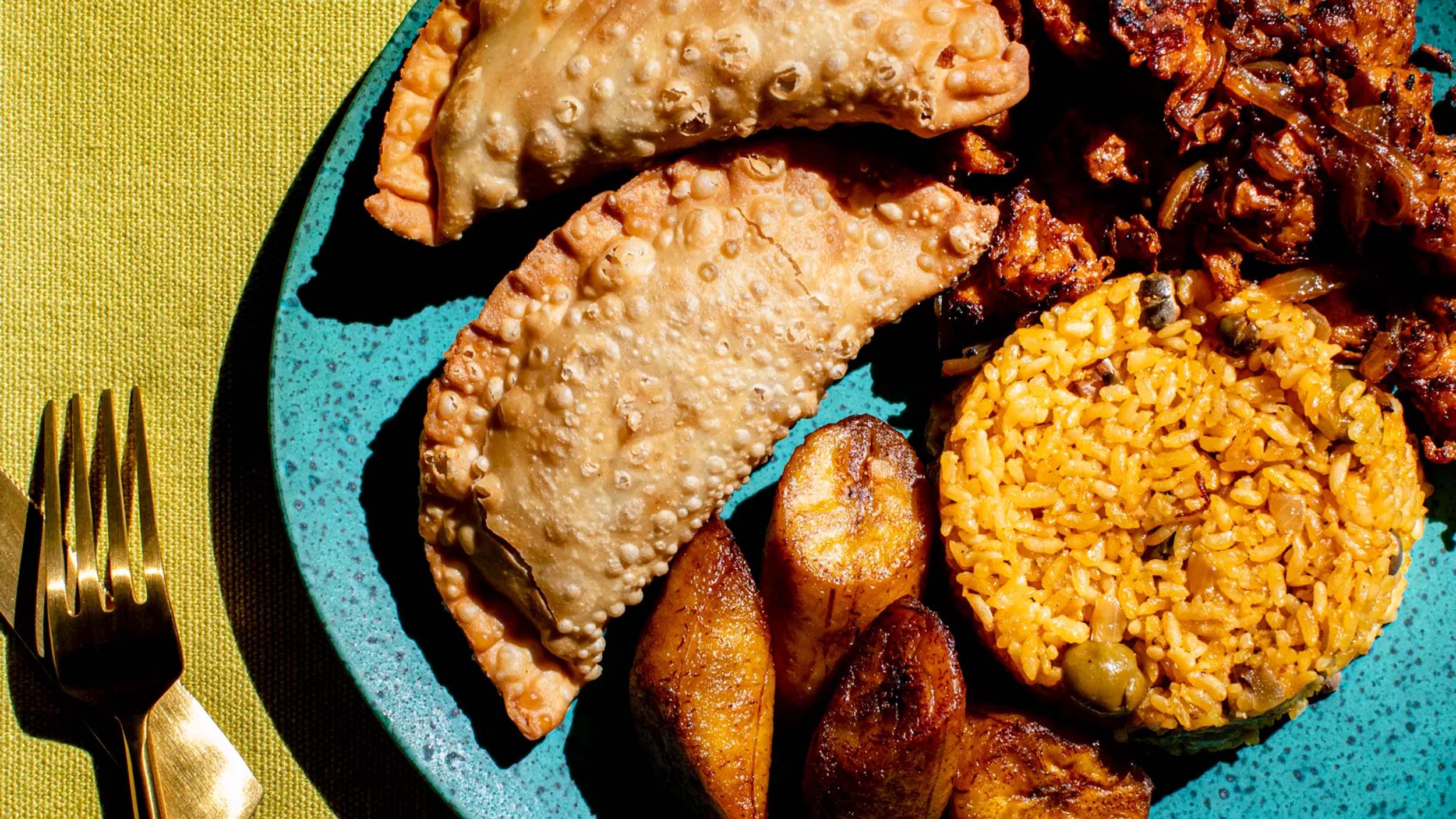 close up photo of puerto rican foods on a blue plate