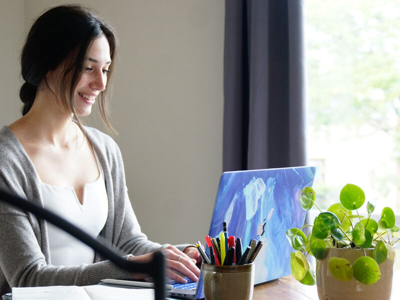 student works on laptop at the table