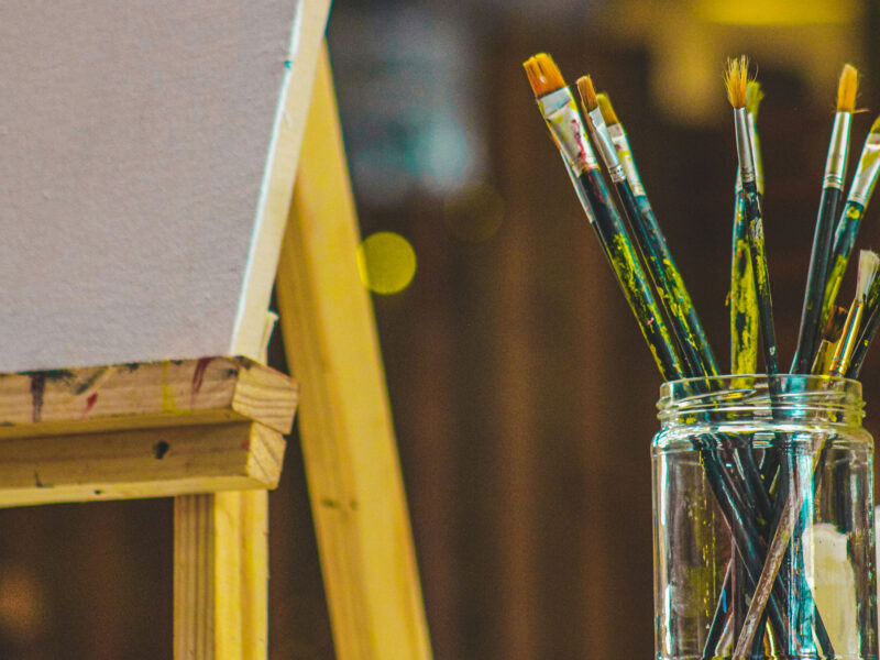 paint brushes in a mason jar