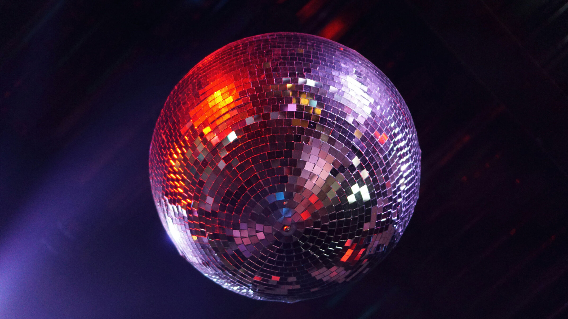 silver sparkly disco ball hanging from ceiling