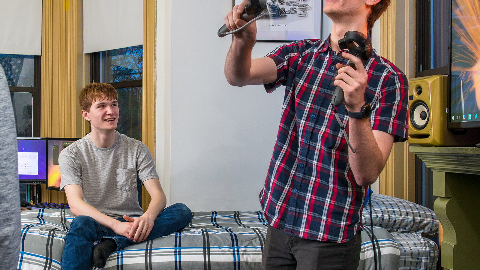 students using a VR headset in a dorm room