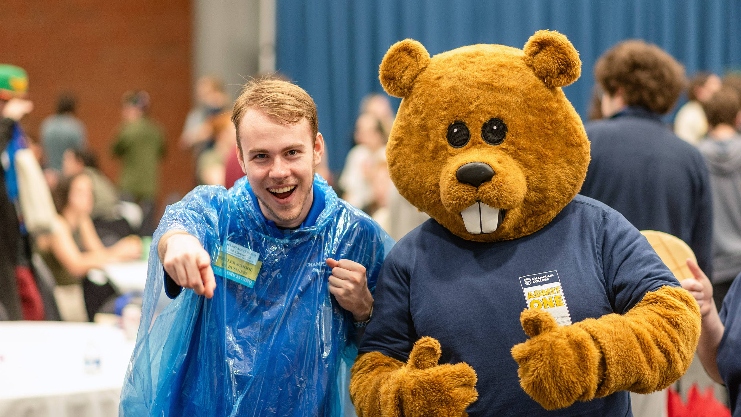 Chauncey the beaver and a student get hyped for the camera