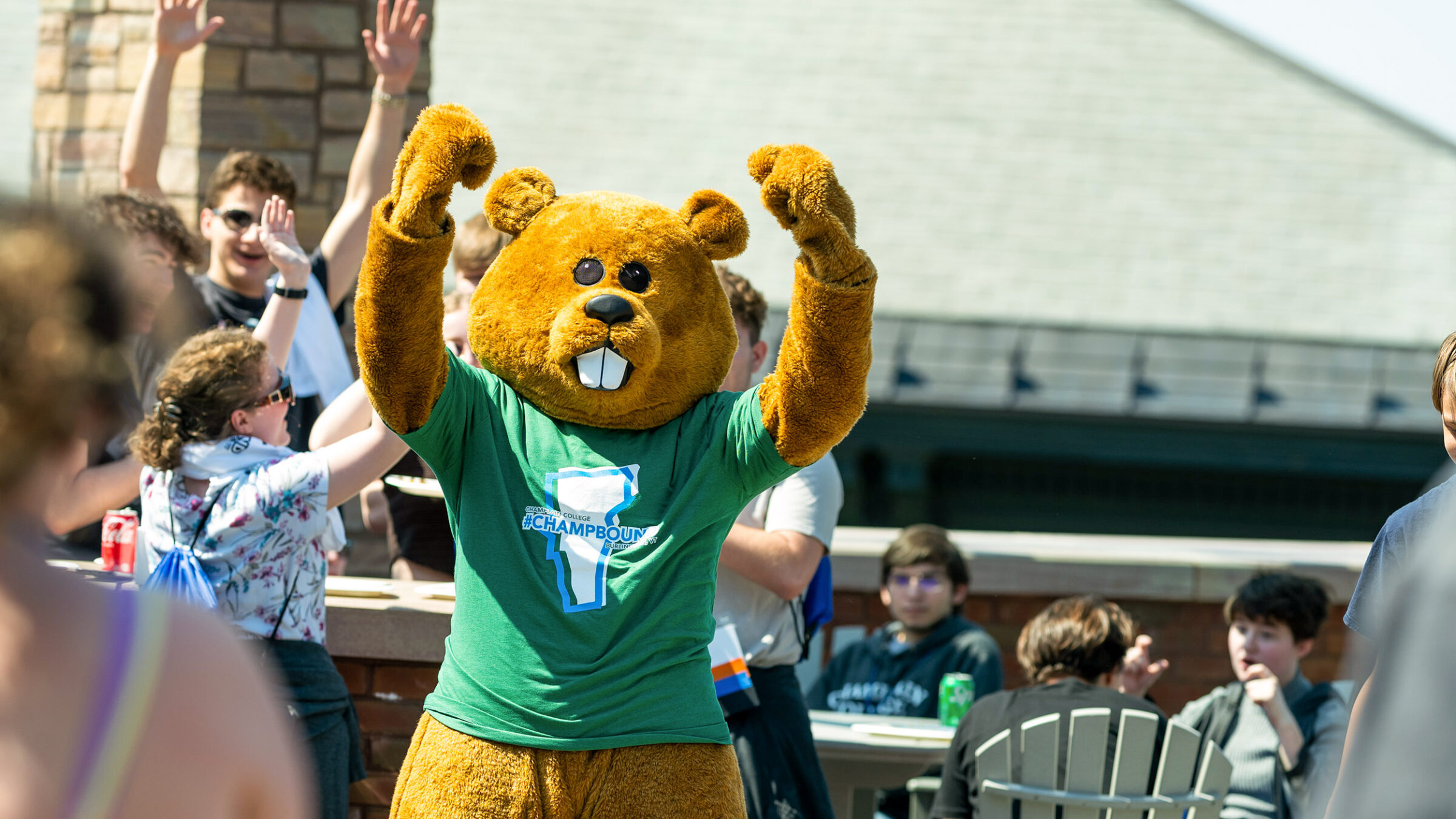 Chauncey the Beaver mascot throws arms in the air in success