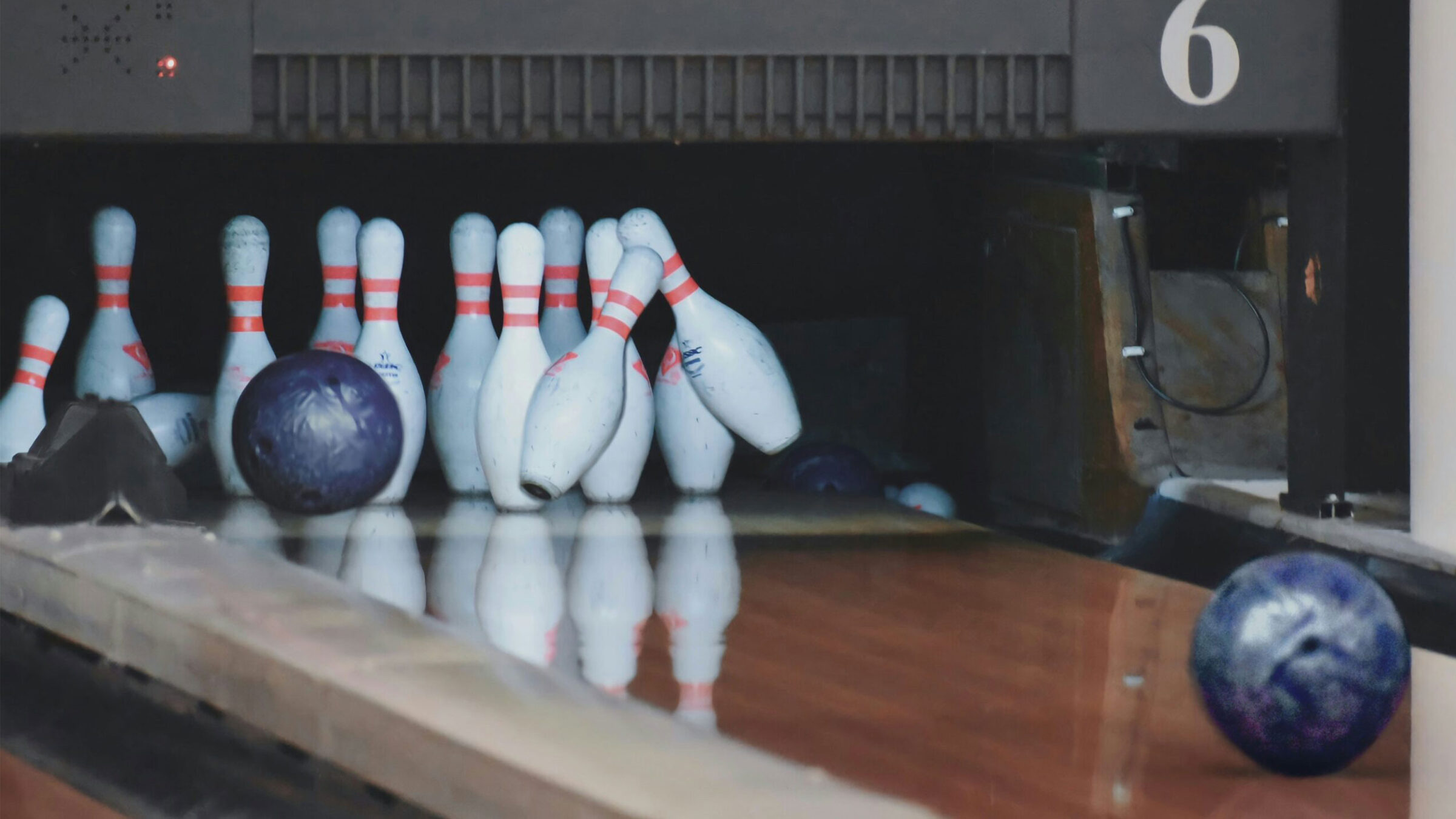 bowling ball hitting bowling pins