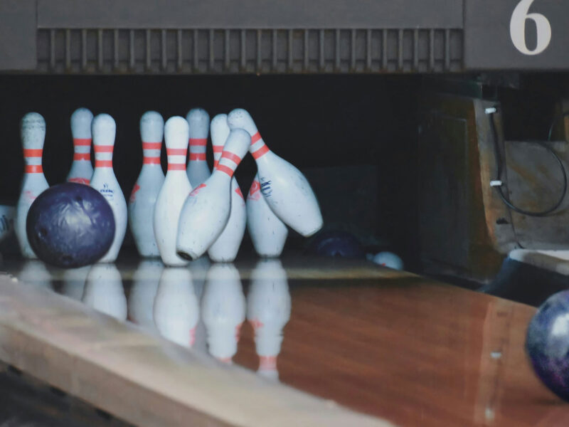 bowling ball hitting bowling pins