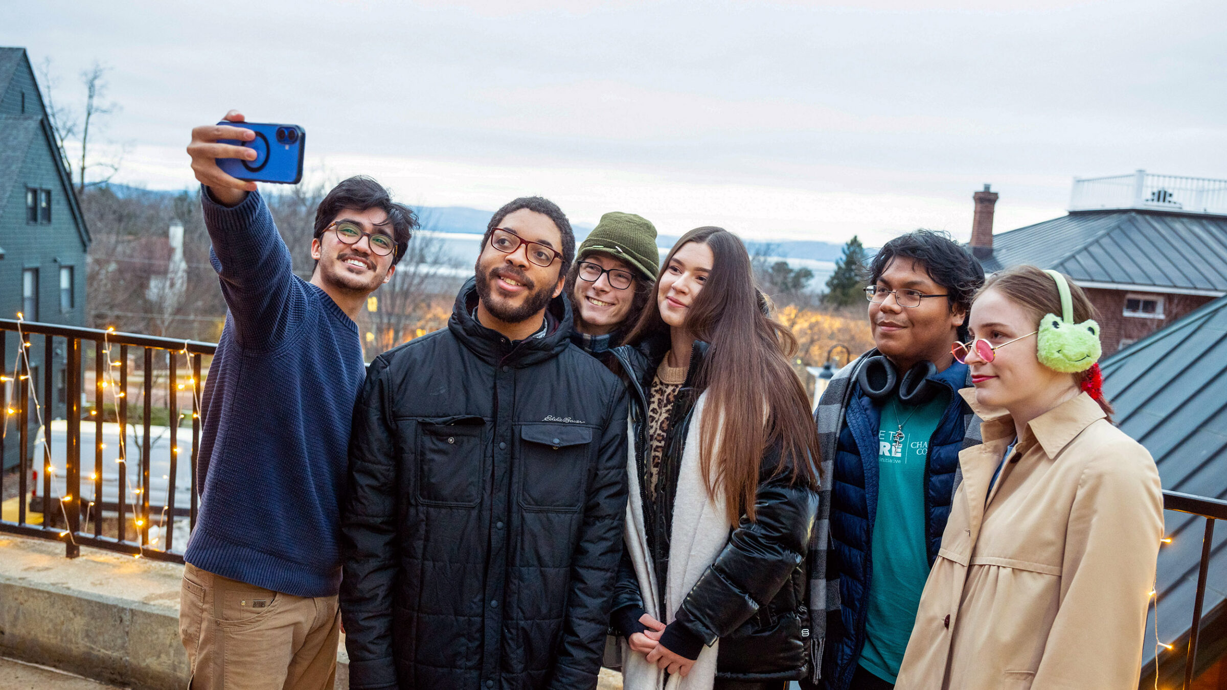 Students taking a selfie on campus in the winter