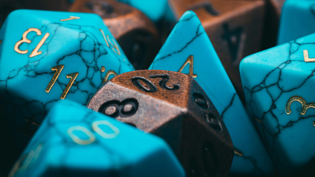 Blue and copper colored dice in a pile